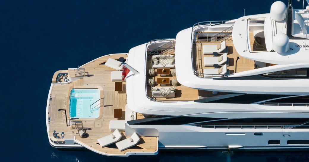 Infinity pool onboard charter yacht Alunya with side balconies down