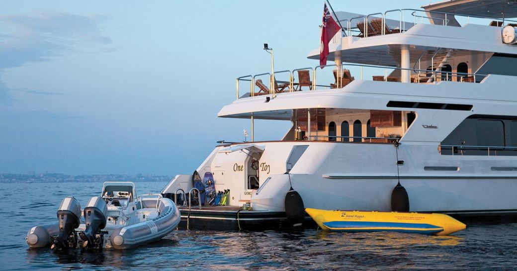 swim platform of motor yacht ‘One More Toy’ alongside tender and water toys