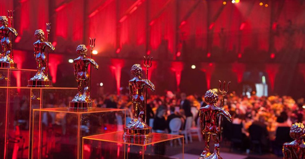 neptune trophies lined up at world superyacht awards