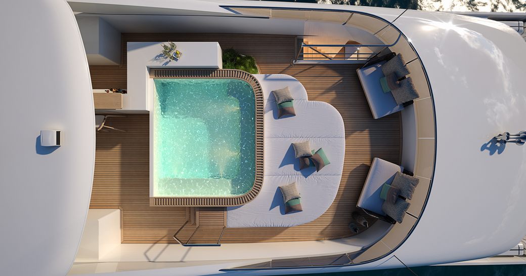 Elevated view looking down on the on-deck Jacuzzi on motor yacht IRIS BLUE