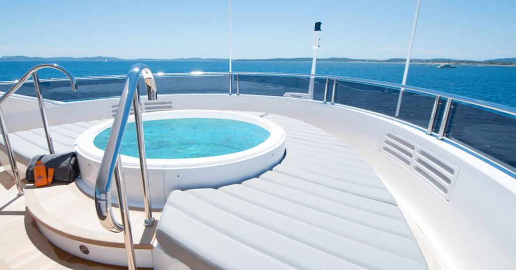 A view of a Jacuzzi which looks across the ocean from on board a superyacht