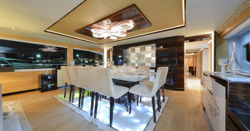 sophisticated dining area in main salon of charter yacht ‘Ghost II’ 
