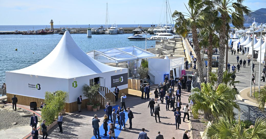 Exterior view of the MIPIM convention in Cannes, with views of the marina and the Bay of Cannes