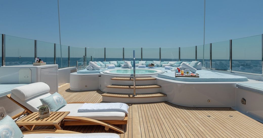 sun loungers, Jacuzzi and sunpads on the sundeck of superyacht La Mirage 