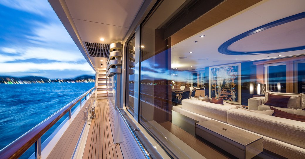 View of side deck and main salon on board motor yacht GO