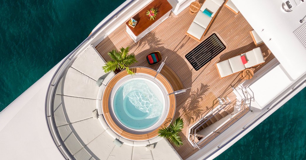 spa pool, sun pads and sun loungers on the sundeck of motor yacht GLADIATOR 
