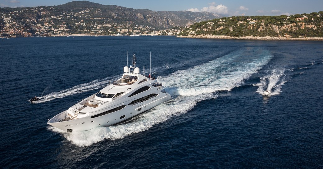 motor yacht THUMPER cruising on charter in Ibiza along side tenders