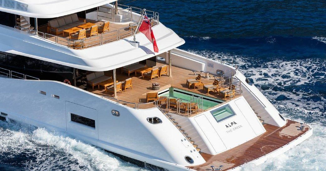 Aft decks of charter yacht ALFA, infinity pool on the main deck with ample seating surrounding the pool and on the upper deck