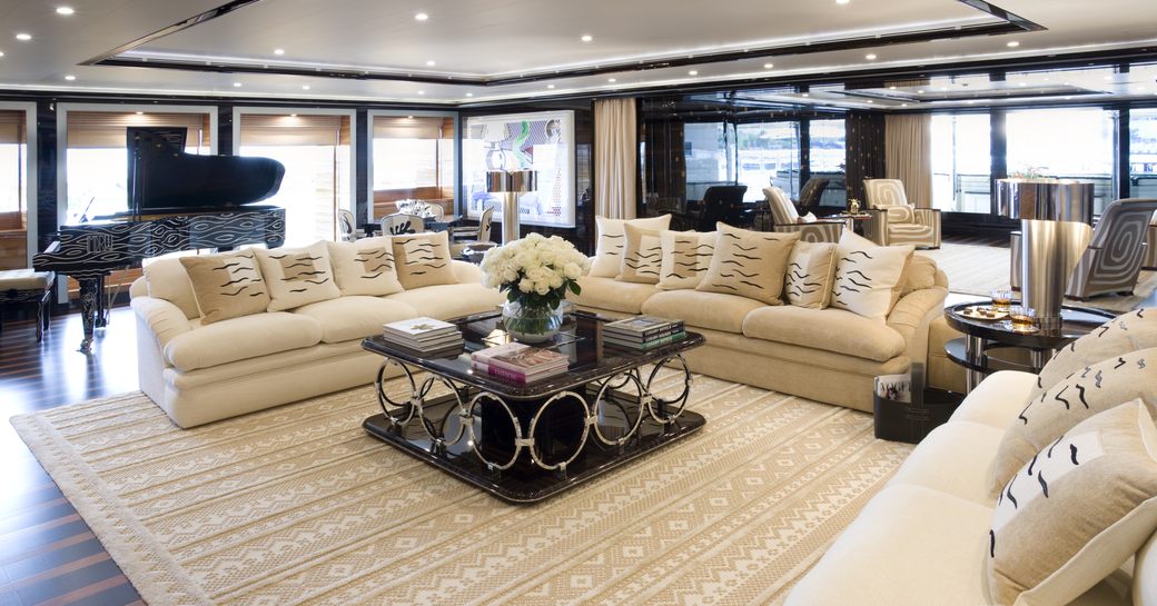 The cream furnishings which compose the main salon of superyacht 'Alfa Nero'