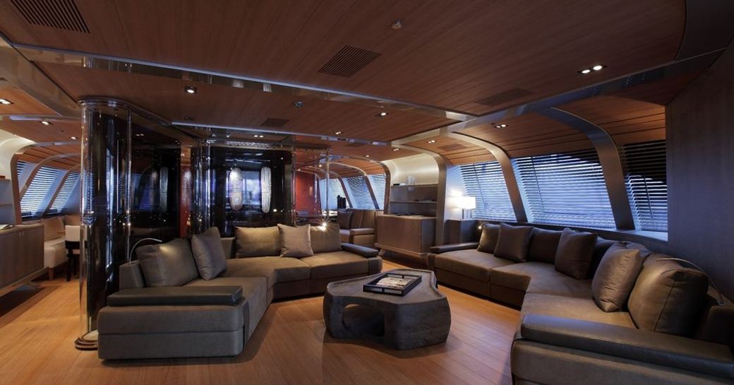 large grey sofas in the teak-clad main salon aboard sailing yacht SEAHAWK 