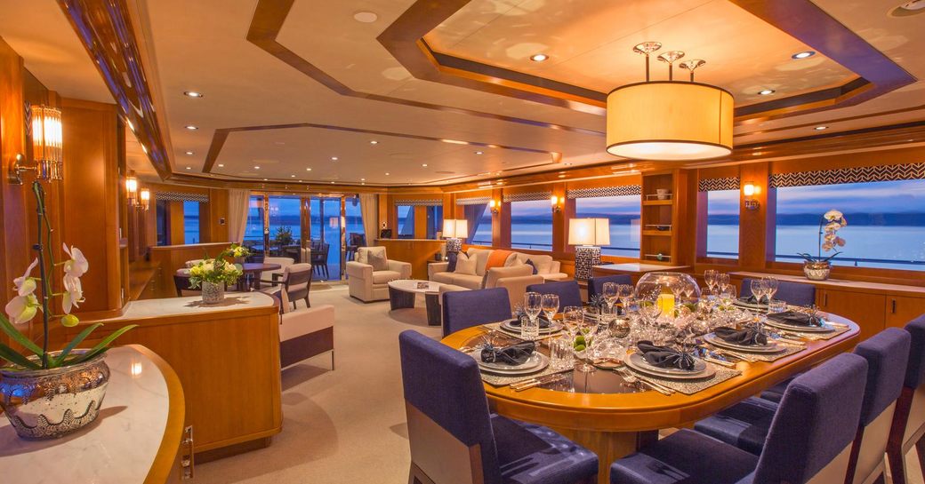 dining table and lounge in main salon aboard superyacht Far Niente