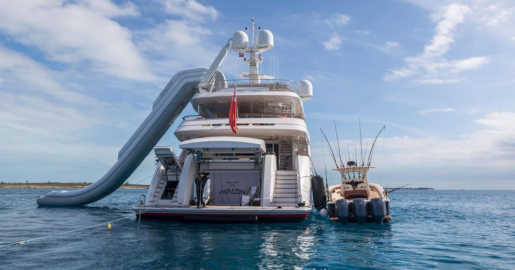 beach club and swim platform on board superyacht AVALON with slide and tender in shot