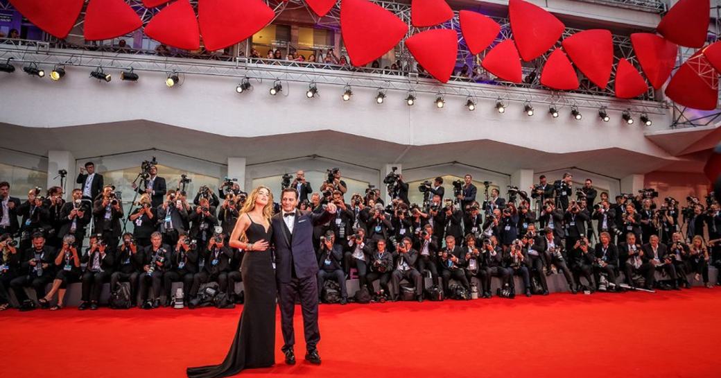 Actors on red carpet at the Venice Film Festival