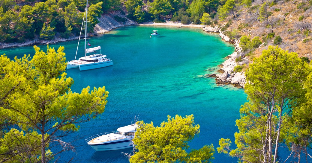 Croatia yacht charter vacation, yachts in crystal clear bay 