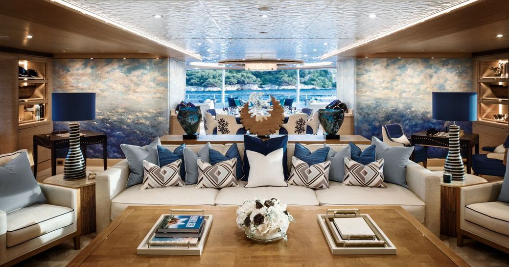 white sofas and coffee table in the Winch Design-styled skylounge aboard motor yacht Cloud 9