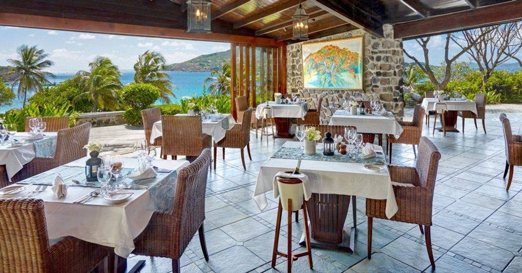 A restaurant at the luxury resort on the private island of Petit St Vincent, Caribbean