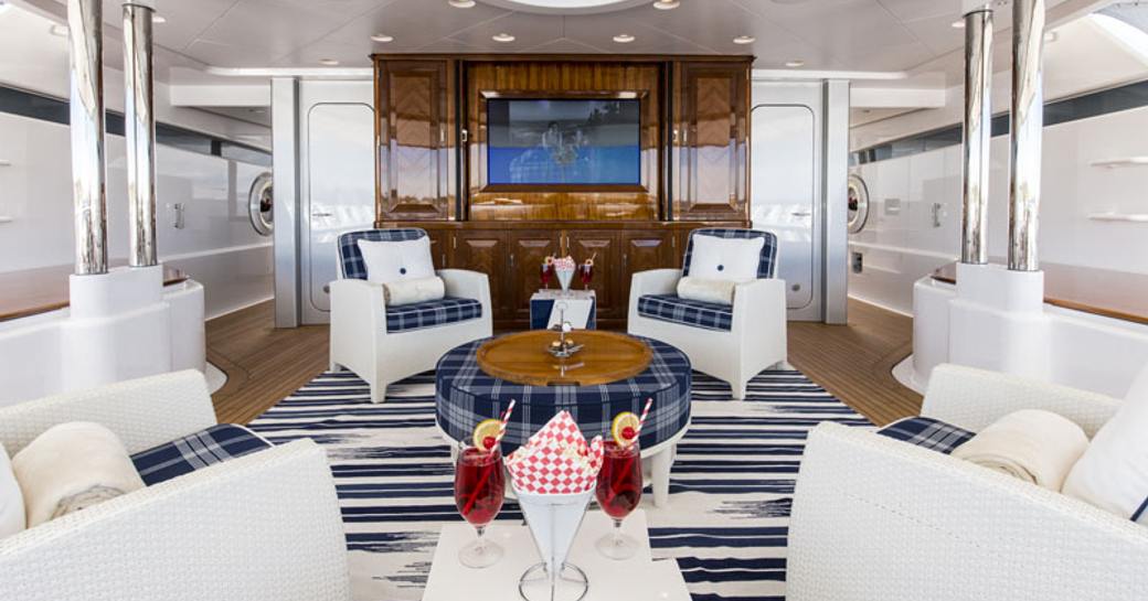 seating area in the shade on the sundeck of luxury yacht ‘Blue Moon’