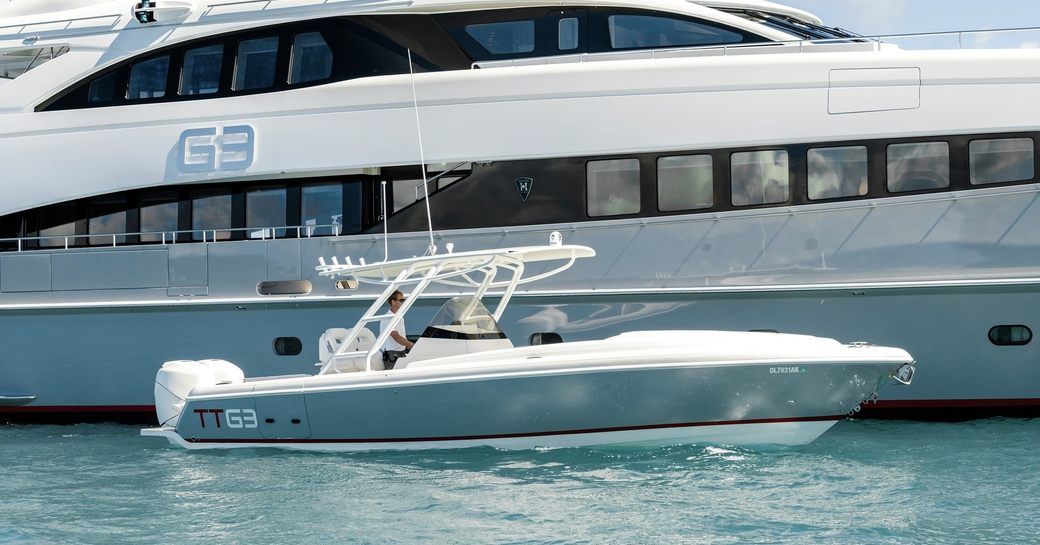 A tender sat on the water adjacent to luxury yacht charter G3