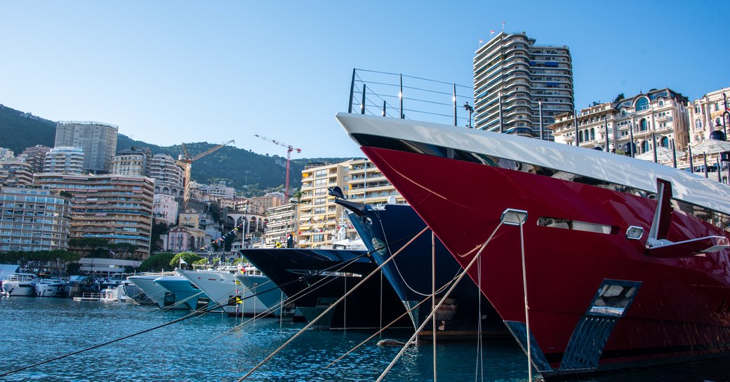 Close up of a line of superyacht bows at Port Hercule, Monaco