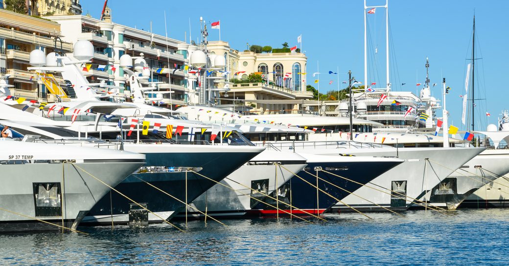 Line of in-water yachts at the Monaco yacht show