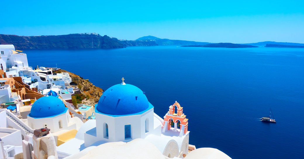Blue buildings and incredibly blue water in Greece