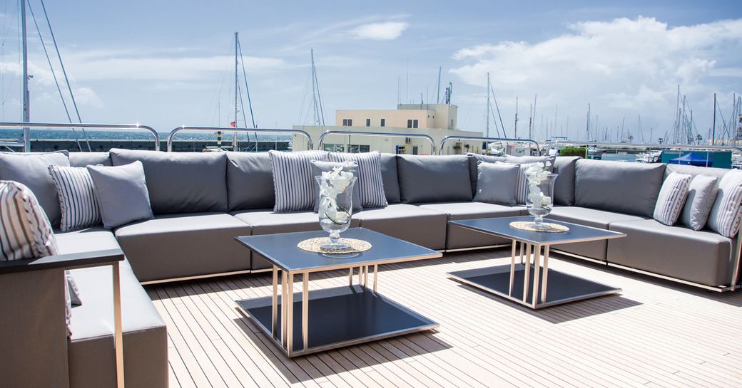 U-shaped sofa on the upper deck aft of luxury yacht ‘Princess AVK’ 