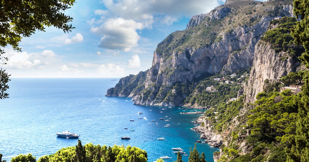 capri coastlines with Mediterranean sea and yachts on the water