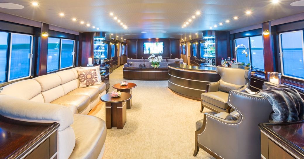 cream leather sofa and armchairs in main salon of motor yacht UNBRIDLED 