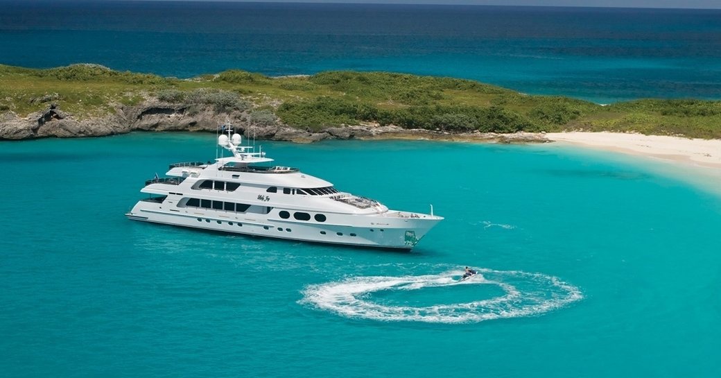 superyacht ‘Lady Joy’ in an idyllic anchorage on a luxury yacht charter