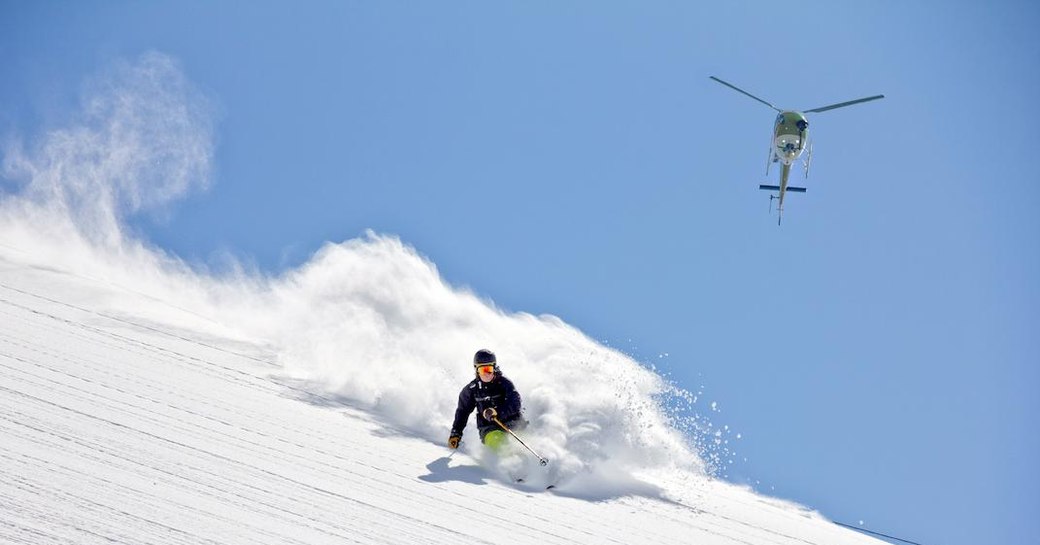 Heli-skiing on an explorer yacht charter onboard MY La Datcha