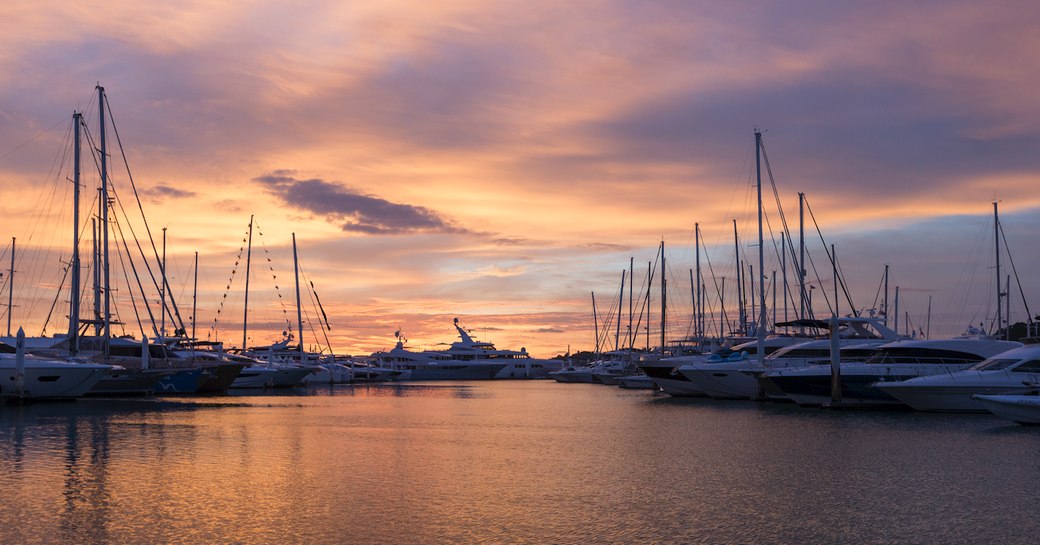 sun sets over the Thailand Yacht Show 2018 in Ao Po Grand Marina, Phuket