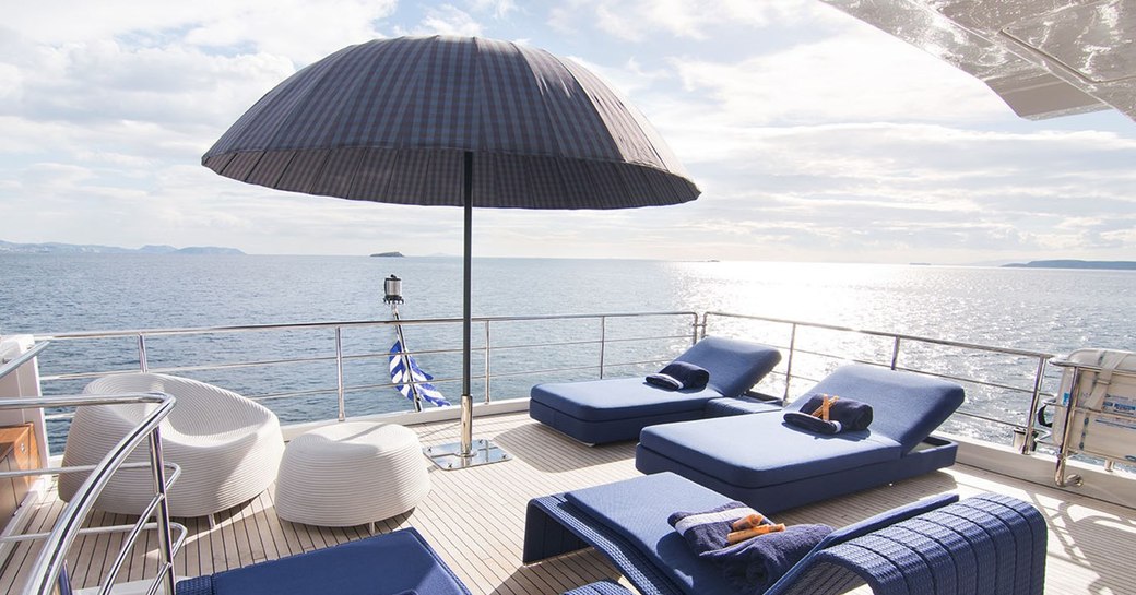 Sunbeds on aft deck of motor yacht MEMORIES TOO