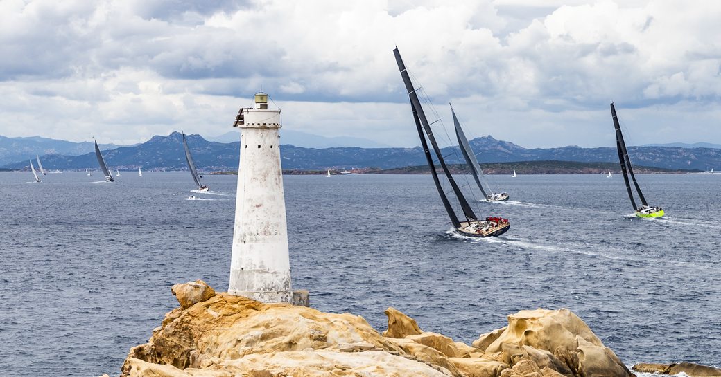 sailing yachts cut through the water off the coast of Porto Cervo at the Loro Piana Superyacht Regatta 2018 