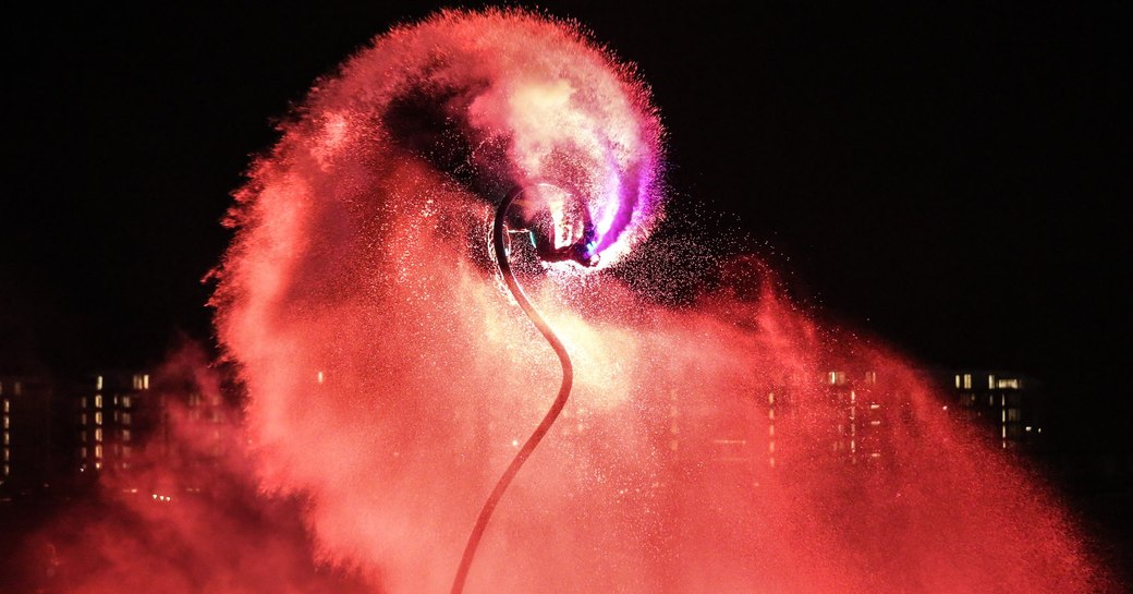 Flyboard demo at night at the Dubai International Boat Show 