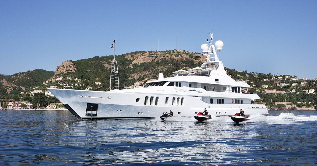 charter guests try out the jet skis aboard charter yacht Talisman Maiton