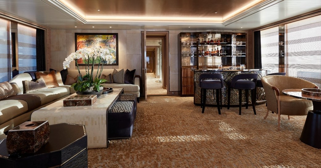 comfortable seating and Irish whiskey bar in the main salon aboard superyacht JOY