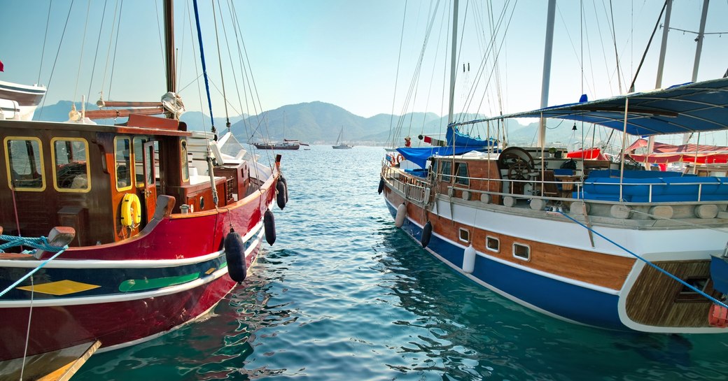 luxury gulets lined up in Turkish harbour