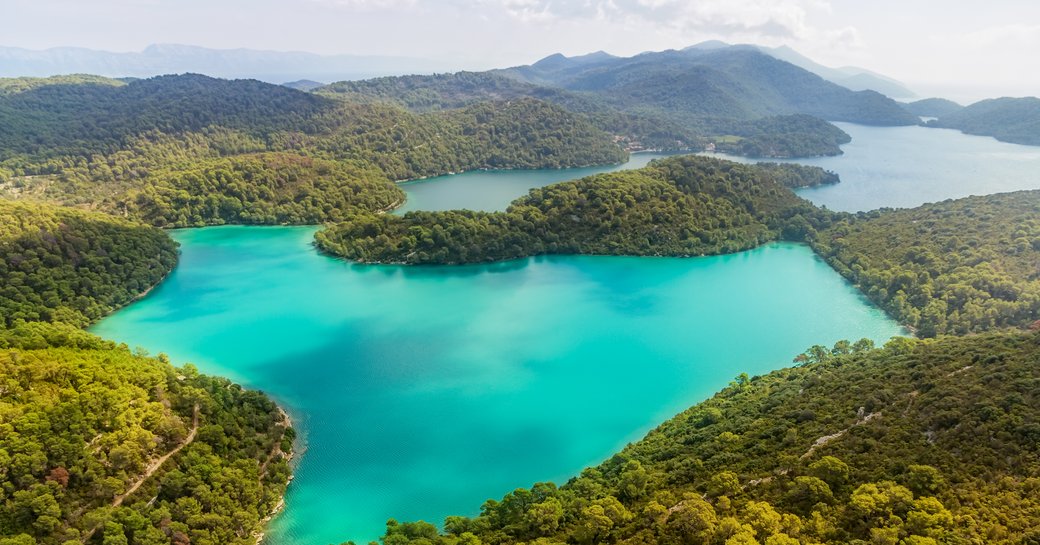 Aerial helicopter shoot of National park on island Mljet, Dubrovnik archipelago, Croatia. The oldest pine forest in Europe preserved.