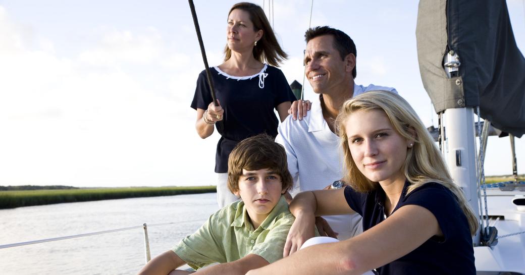 Family of four on board a sailing yacht