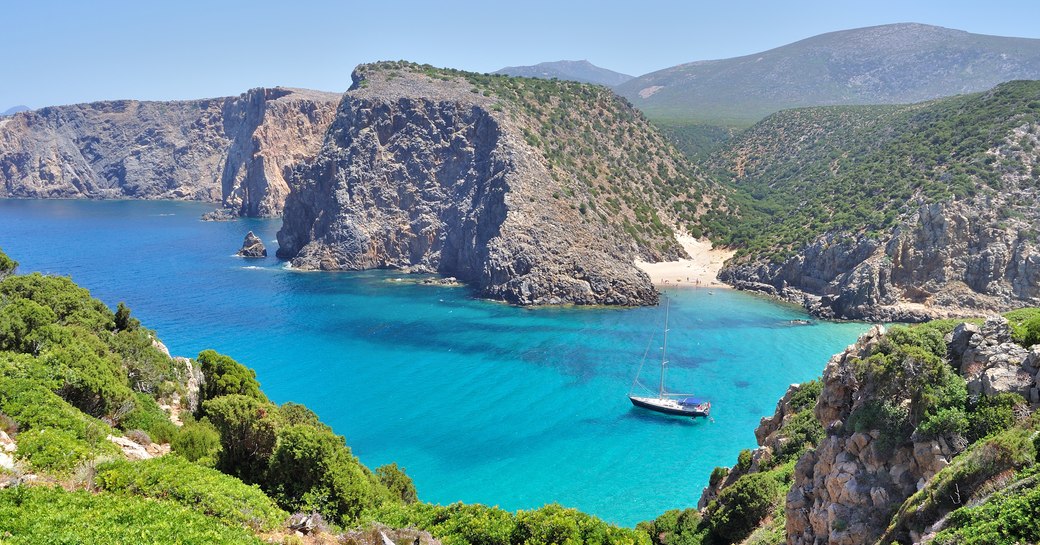 yacht in crystal blue azure waters in Sardinia, Italy