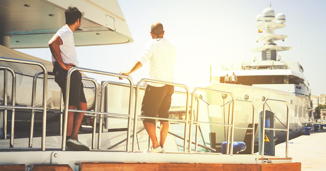 Deckhands keeping watch on a charter yacht 