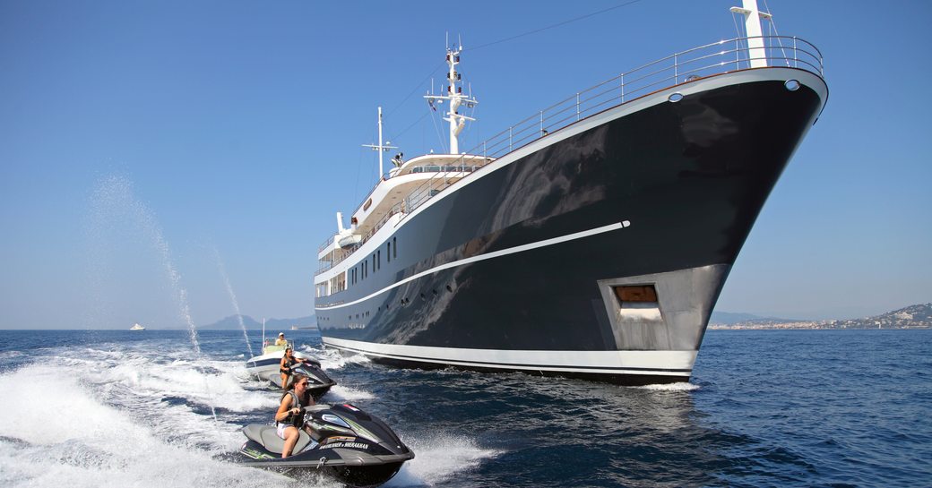 Charter guests enjoy the Jetskis close to superyacht SHERAKHAN