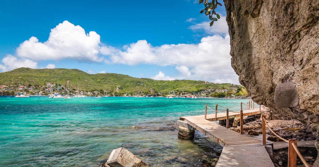 Boardwalk and blue waters leading to Princess Margaret Beach in Bequia