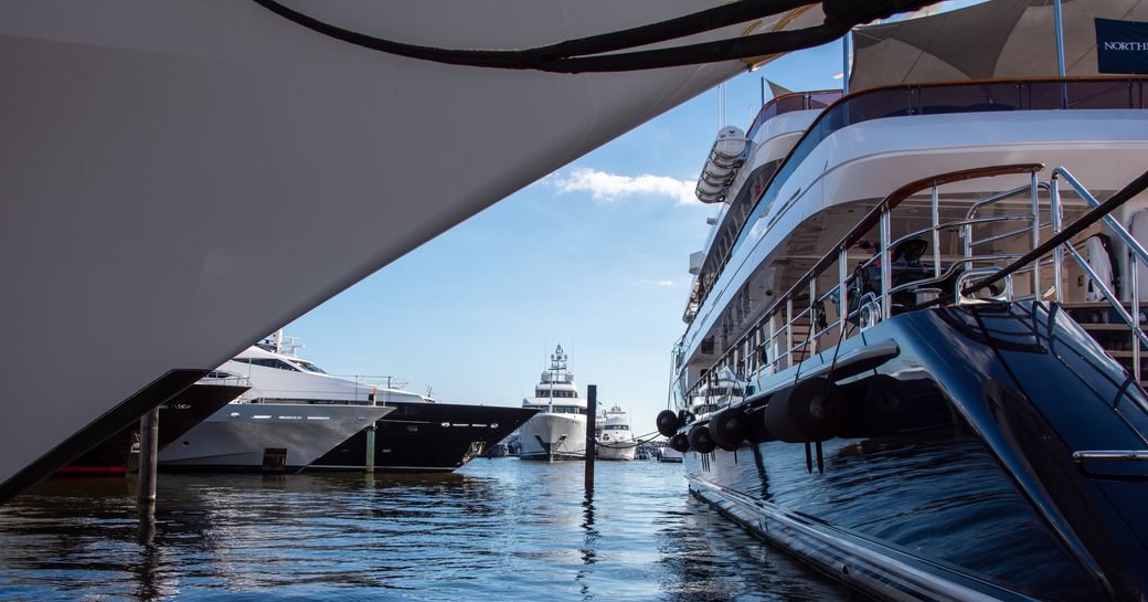 View through some yachts at the Superyacht Village at FLIBS 2022
