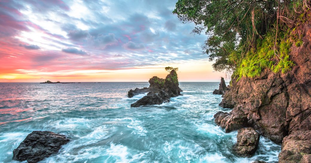 pink sky and blue waters in costa rica
