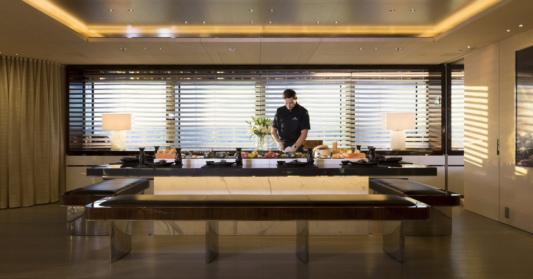 chef preparing food at the sushi bar on board luxury yacht NAUTILUS 