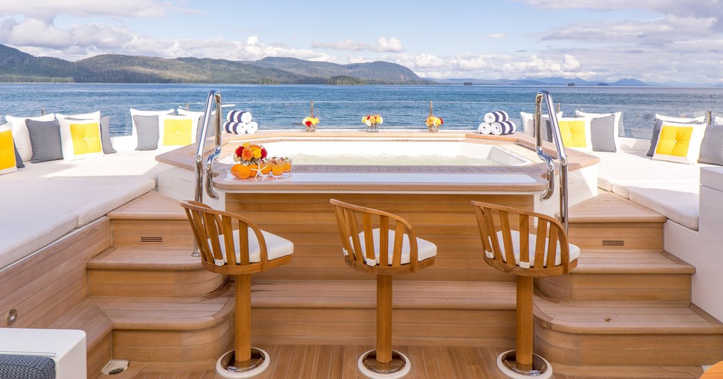 Jacuzzi on sundeck of motor yacht Endless Summer with bar stools