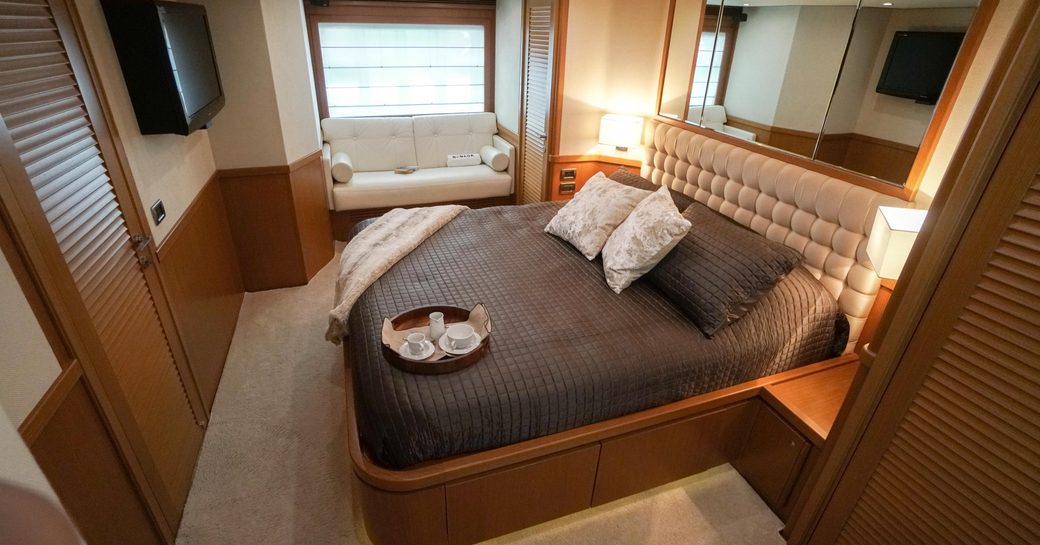 Cabin on charter yacht NOMADA, with wooden effect and lightly colored furnishings