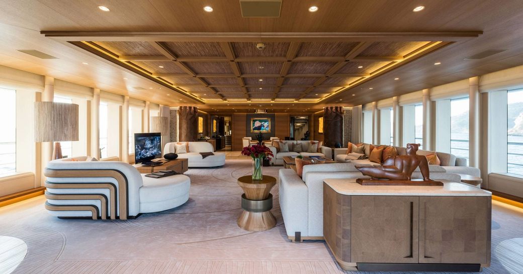 laid-back, curvy sofas in the main salon of motor yacht Here Comes The Sun 
