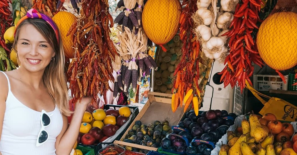 woman admiring fruit stalls in Amalfi coast